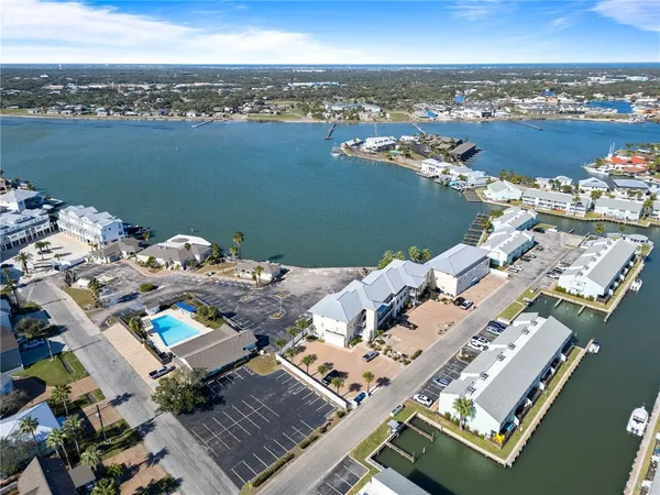 an aerial view of a house with a ocean view