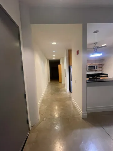 a kitchen with a sink cabinets and stainless steel appliances
