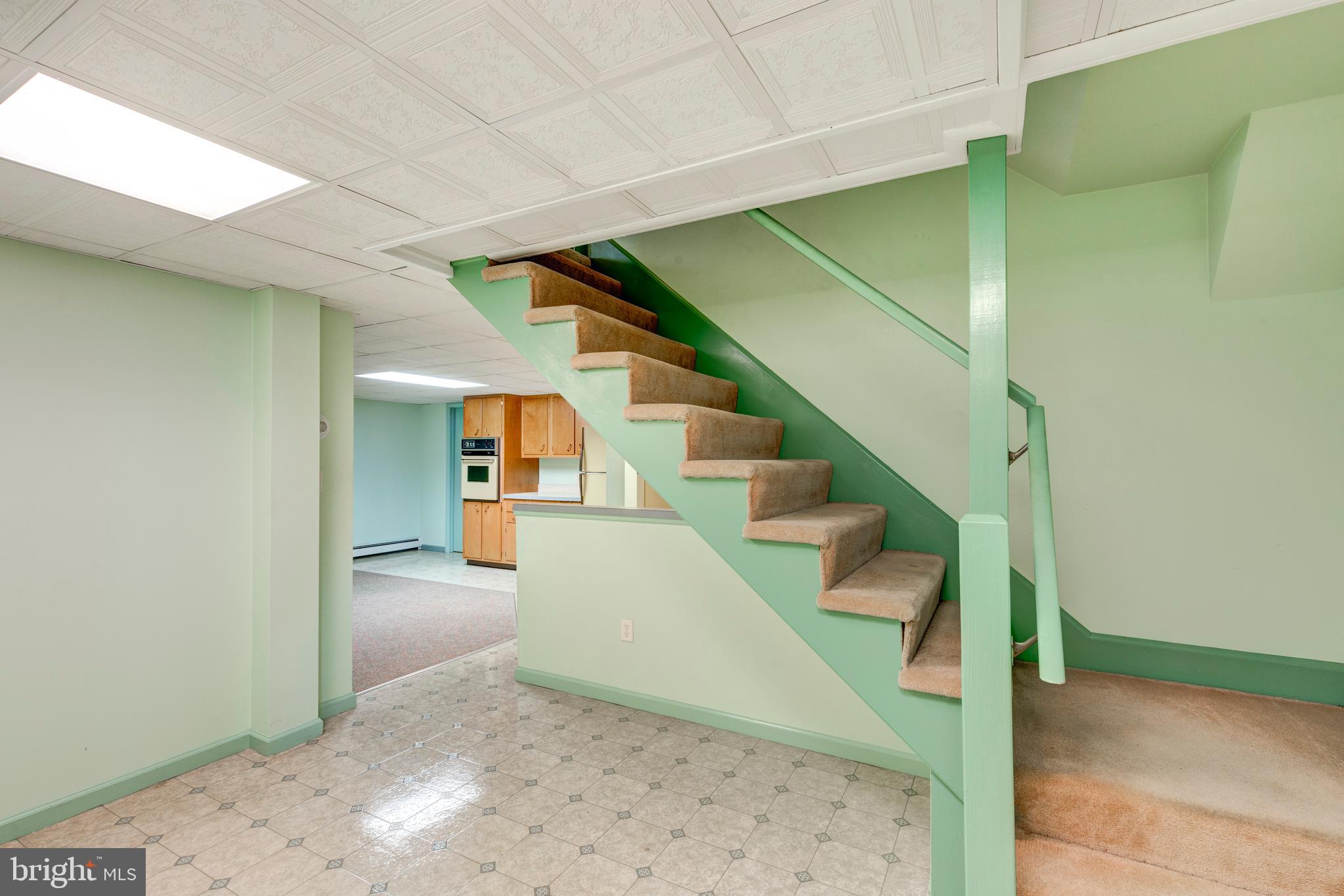 101 Blue Ridge Avenue New Windsor, MD 21776 - Photo 22 of 38 Connecting staircase to the upstairs main level.