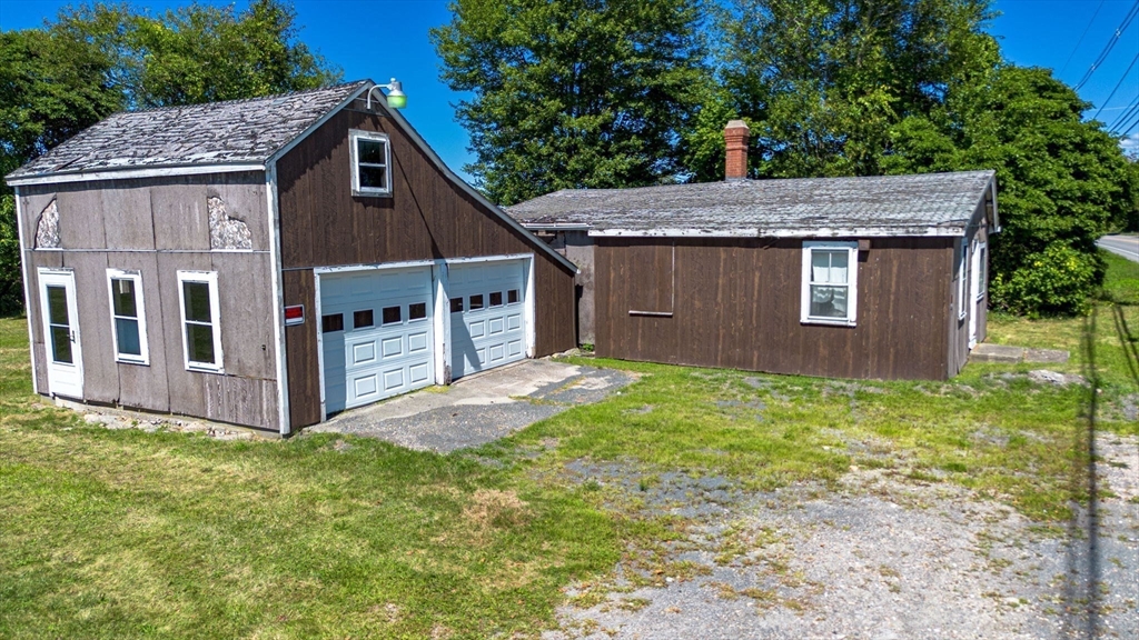 576 Faunce Corner Road Dartmouth, MA 02747 - Photo 13 of 19 a view of a house with a yard plants and large tree