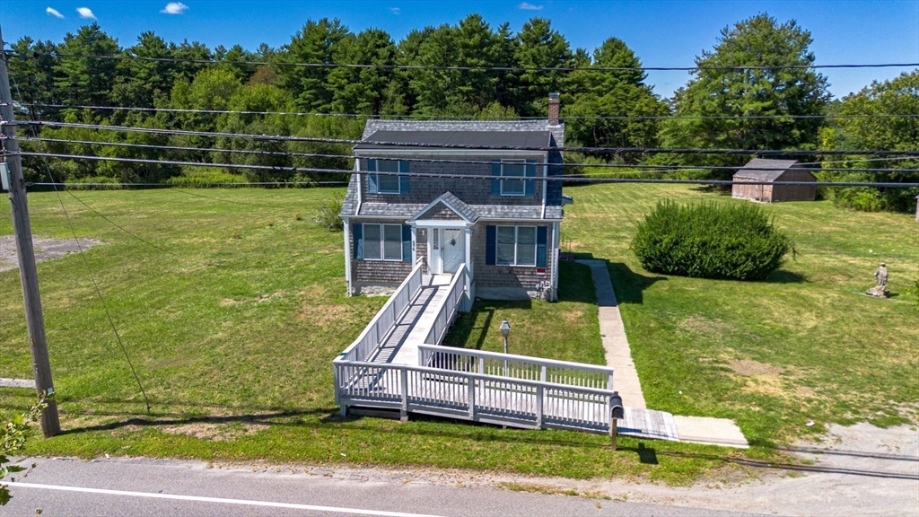 576 Faunce Corner Road Dartmouth, MA 02747 - Photo 5 of 19 a view of a wooden deck with a yard