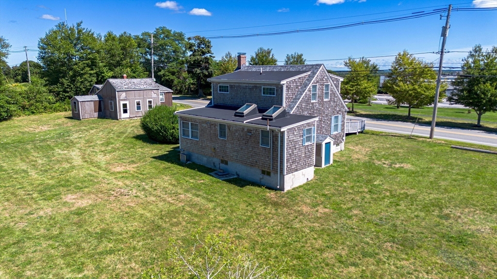 576 Faunce Corner Road Dartmouth, MA 02747 - Photo 9 of 19 a house view with a garden space