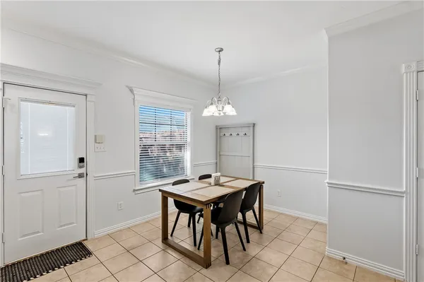a dining room with furniture and window