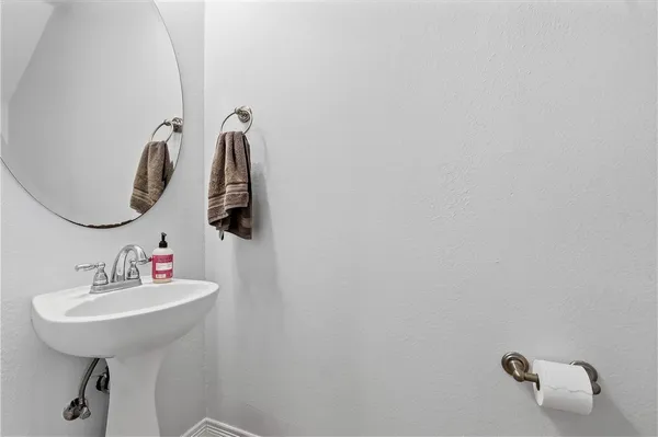 a bathroom with a sink and mirror