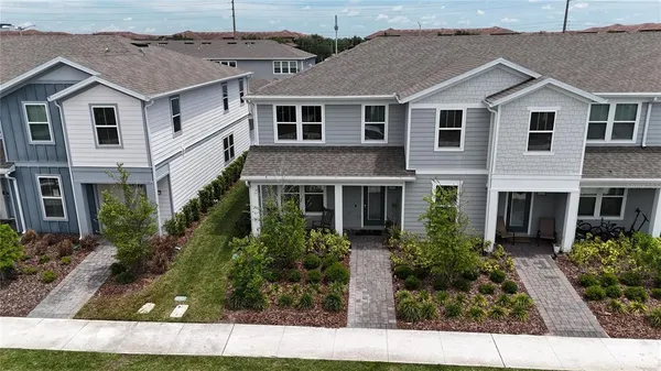 a view of house with garden and entryway
