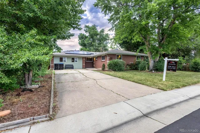 a view of house with a yard