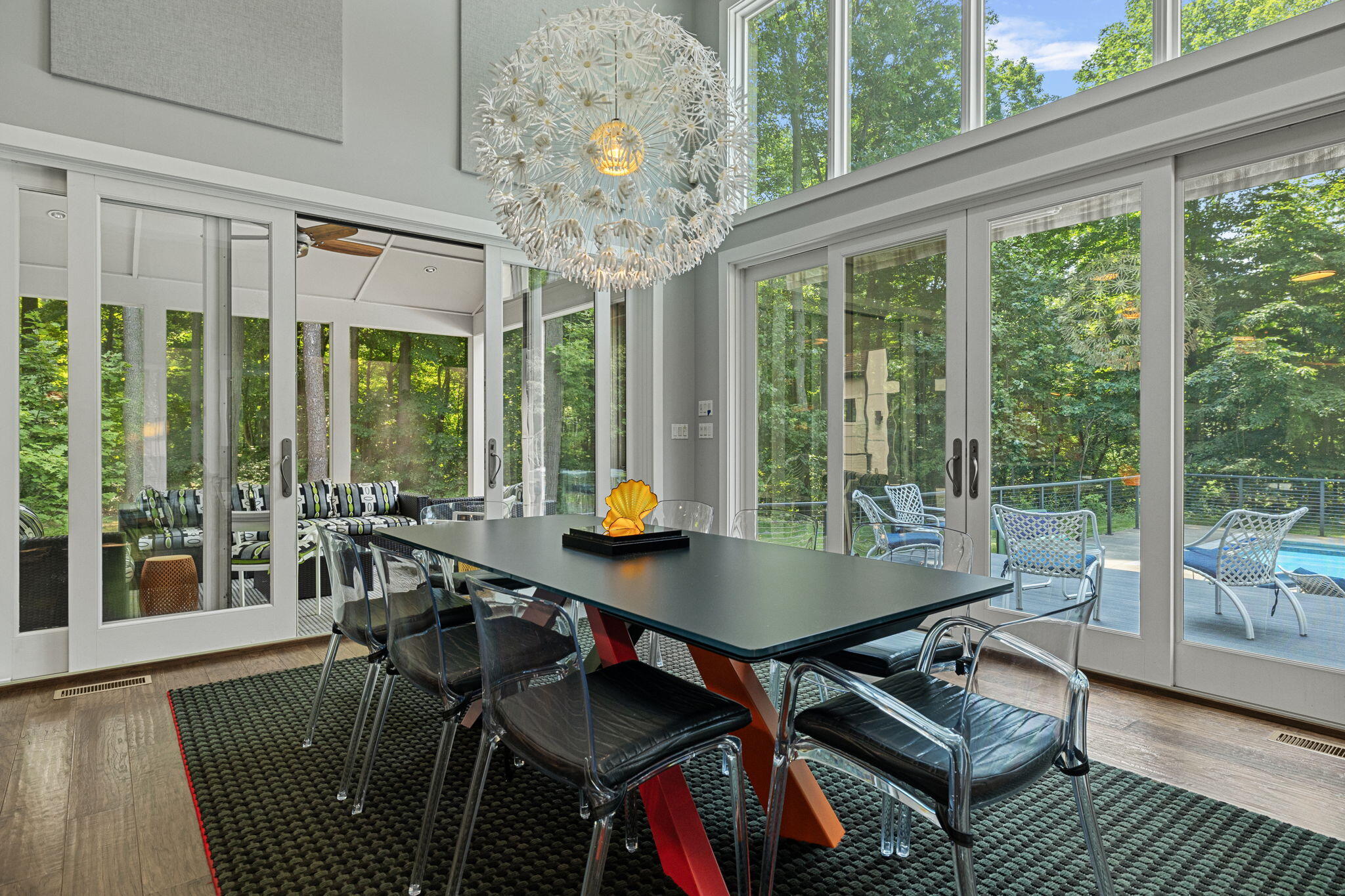 17138 River Bluff Drive, Unit 96 Union Pier, MI 49129 - Photo 13 of 89 a view of a dining room with furniture wooden floor and chandelier