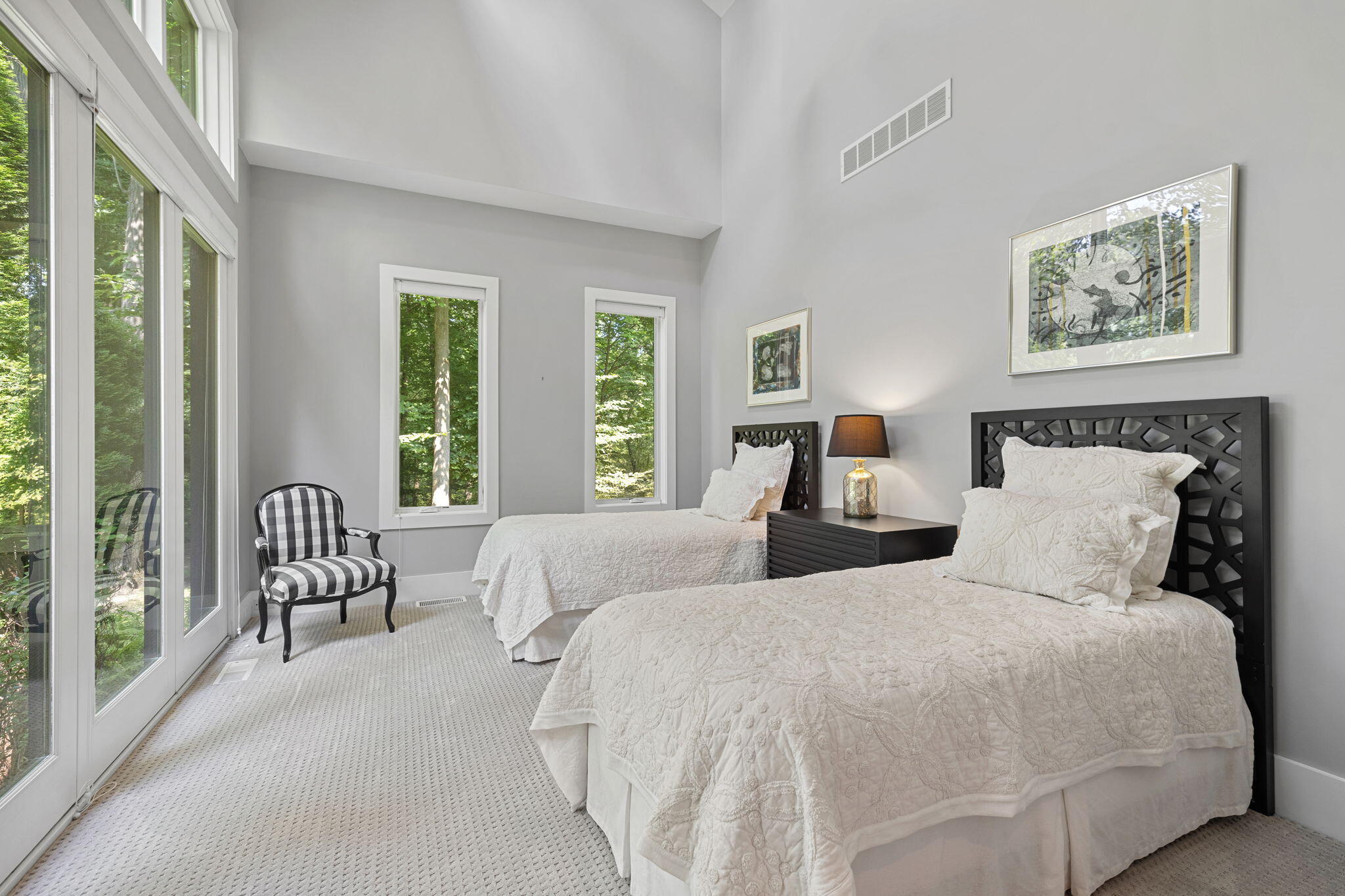 17138 River Bluff Drive, Unit 96 Union Pier, MI 49129 - Photo 47 of 89 a bedroom with two beds and a large window with outer view
