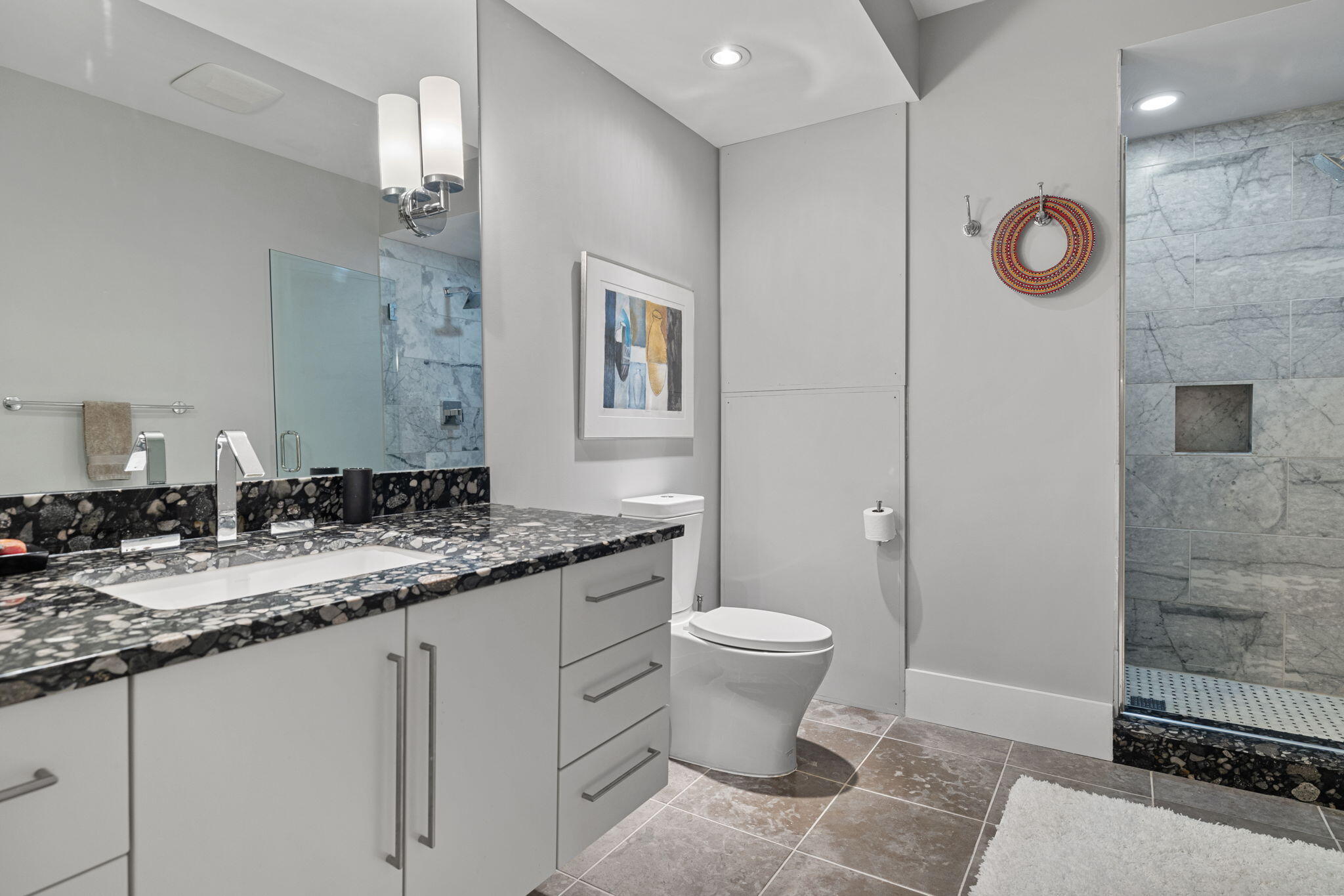 17138 River Bluff Drive, Unit 96 Union Pier, MI 49129 - Photo 69 of 89 a bathroom with a granite countertop sink toilet and a mirror