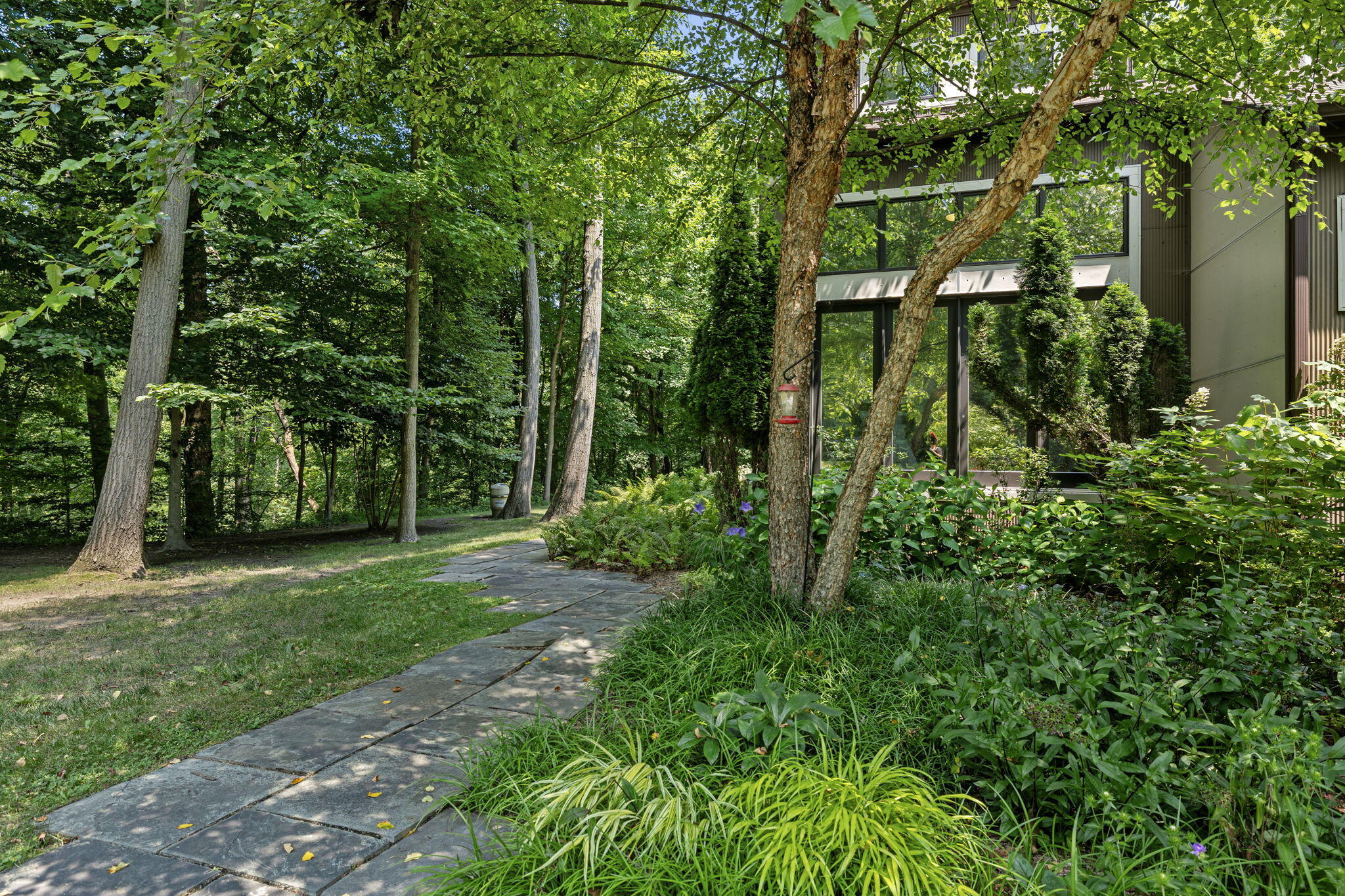 17138 River Bluff Drive, Unit 96 Union Pier, MI 49129 - Photo 75 of 89 a view of a yard with plants and large trees
