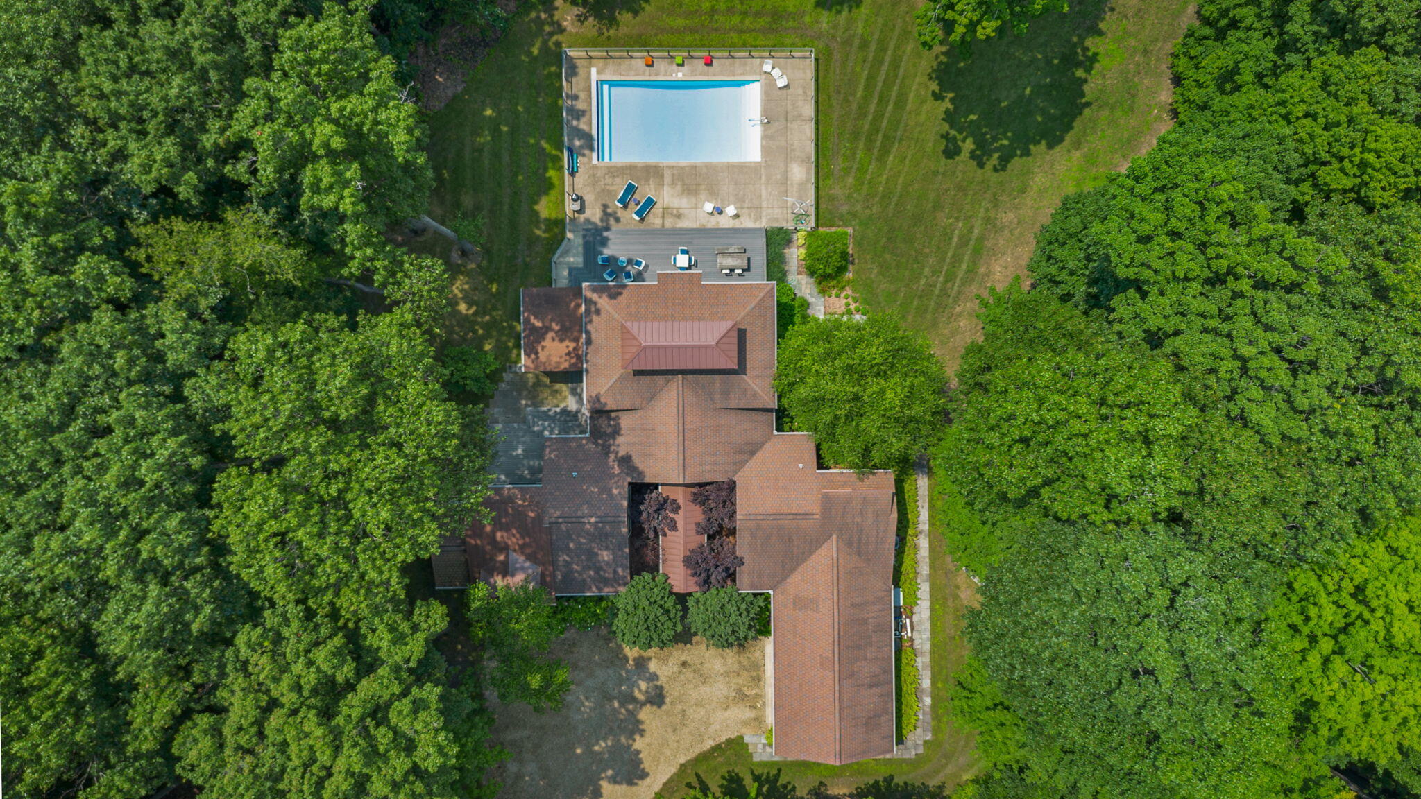 17138 River Bluff Drive, Unit 96 Union Pier, MI 49129 - Photo 79 of 89 an aerial view of a house with a yard and trees all around