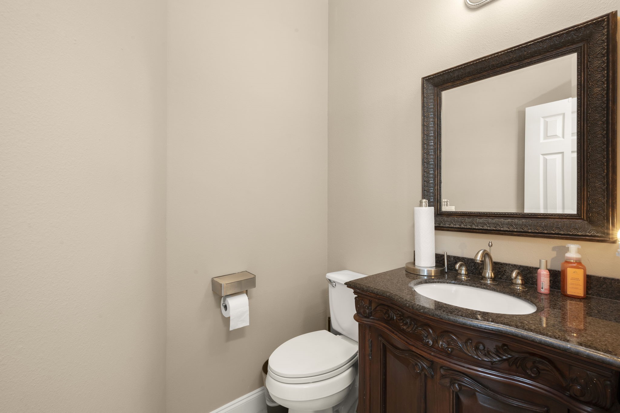 6315 Amelia Springs Drive Spring, TX 77379 - Photo 14 of 46 a bathroom with a granite countertop sink and a mirror