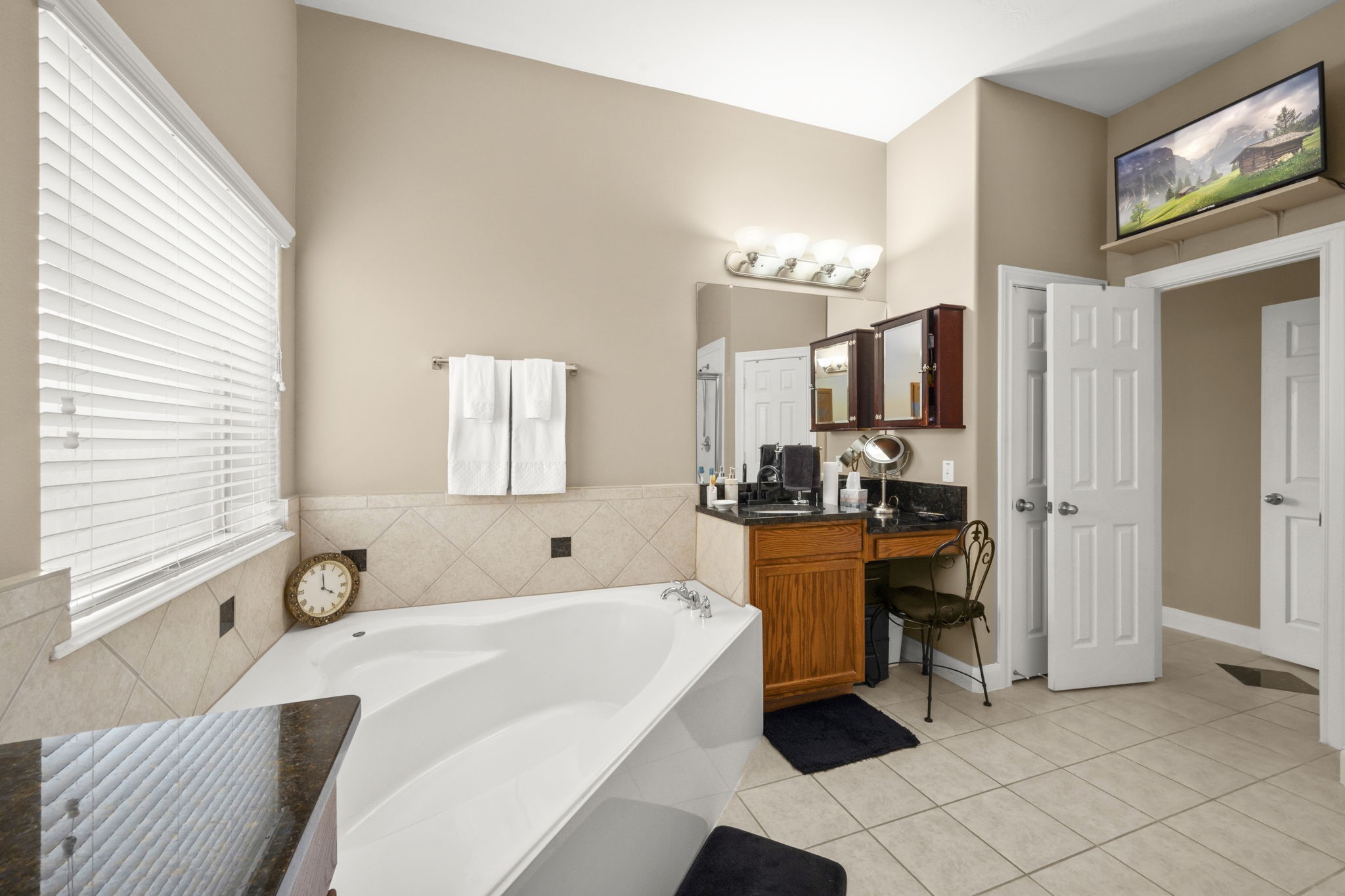 6315 Amelia Springs Drive Spring, TX 77379 - Photo 18 of 46 a spacious bathroom with a tub sink and mirror