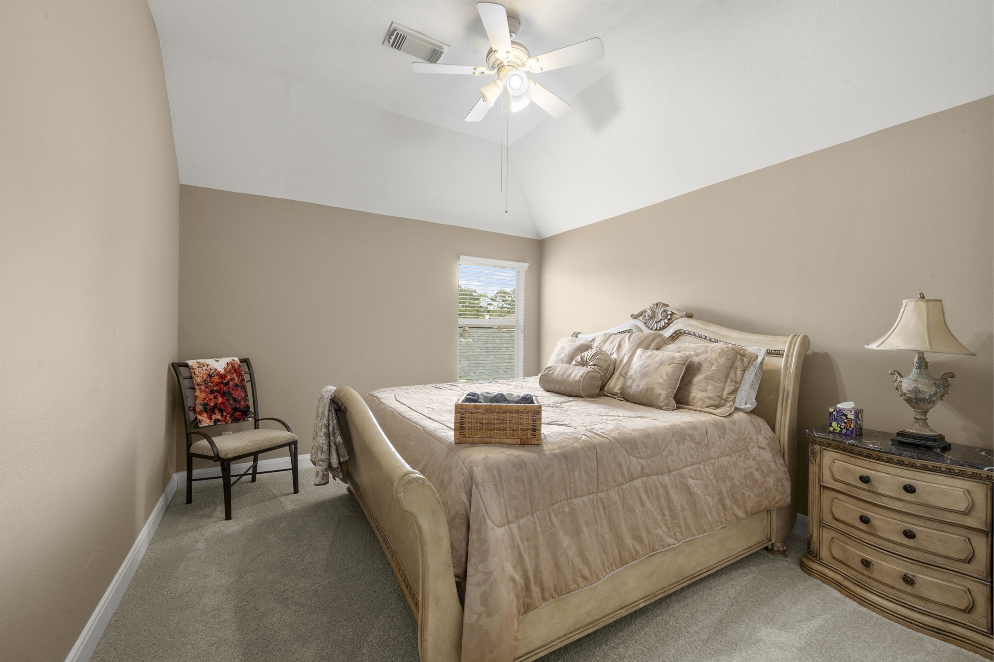6315 Amelia Springs Drive Spring, TX 77379 - Photo 20 of 46 a bedroom with a bed and a chandelier