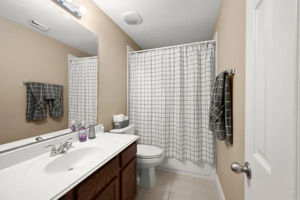 a kitchen with stainless steel appliances granite countertop a sink a stove top oven a counter space and cabinets