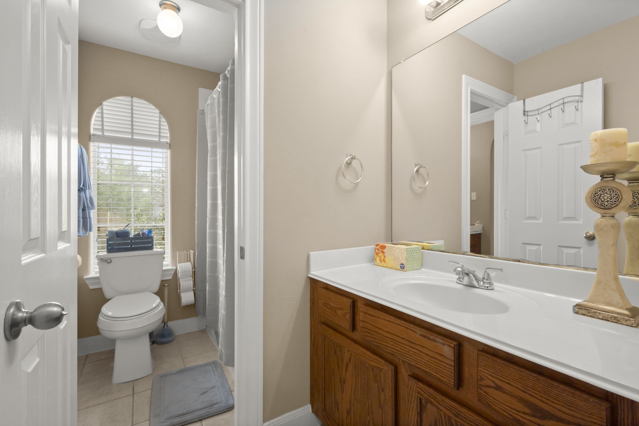 6315 Amelia Springs Drive Spring, TX 77379 - Photo 23 of 46 a bathroom with a sink a toilet and a mirror