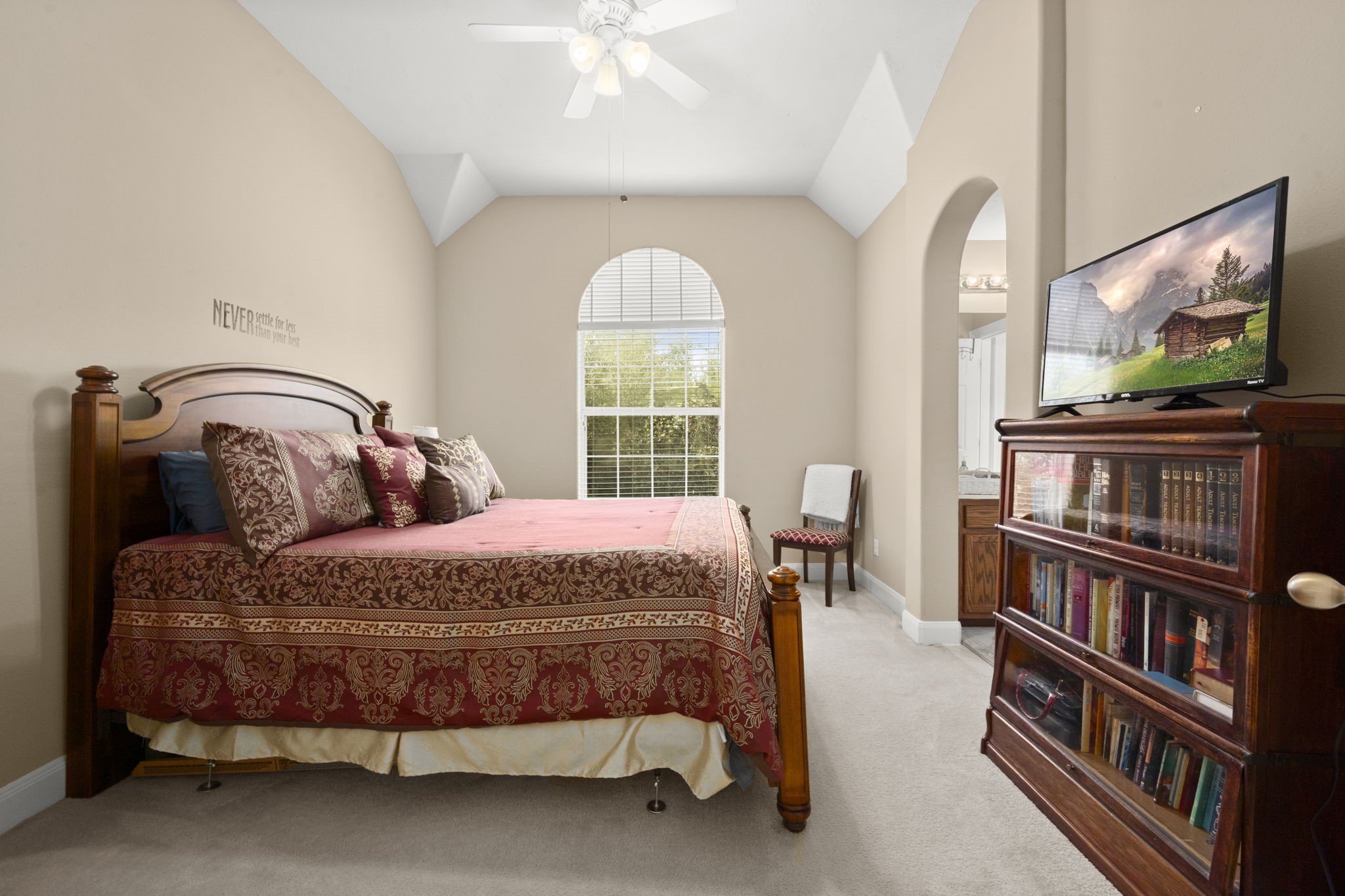 6315 Amelia Springs Drive Spring, TX 77379 - Photo 24 of 46 a bedroom with a bed a large window and a chandelier