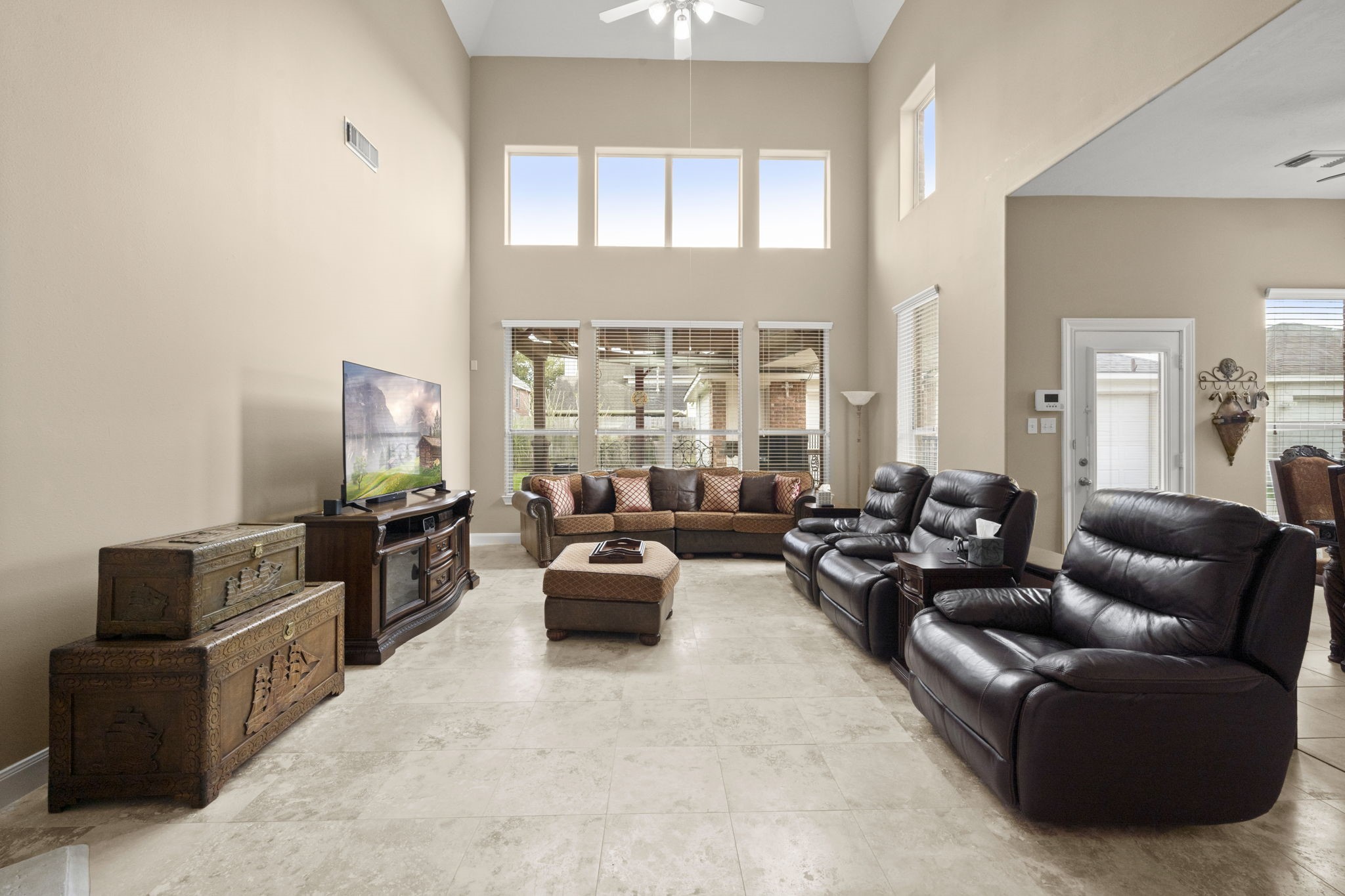 6315 Amelia Springs Drive Spring, TX 77379 - Photo 38 of 46 a living room with furniture and a flat screen tv