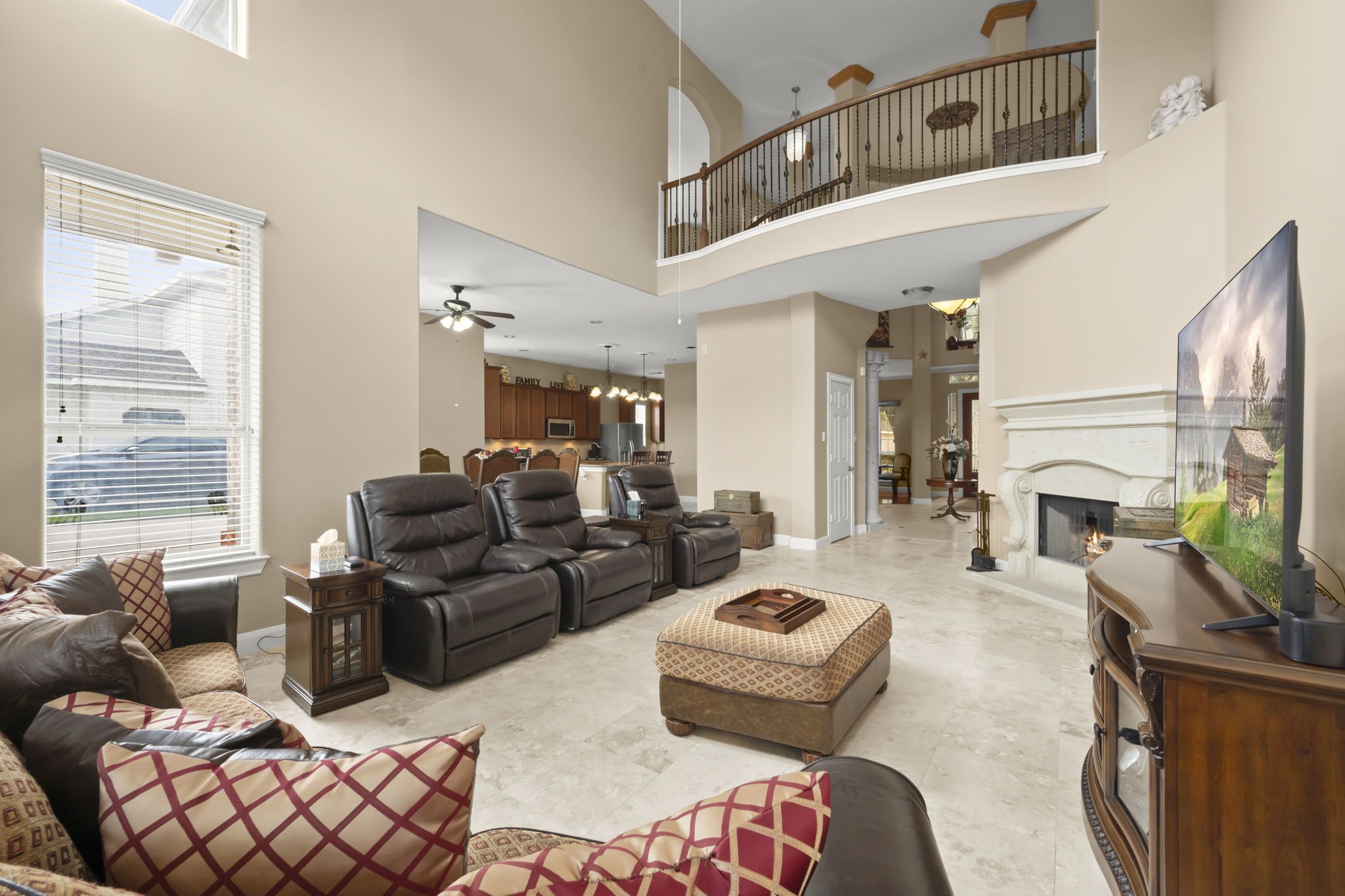 6315 Amelia Springs Drive Spring, TX 77379 - Photo 39 of 46 In the living room with high ceilings and an open layout provides access to view upstairs with natural light.