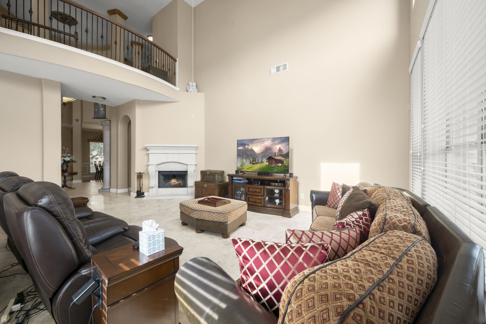 6315 Amelia Springs Drive Spring, TX 77379 - Photo 40 of 46 a living room with furniture a fireplace and a large window
