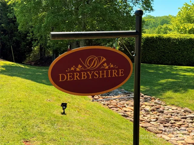 a view of a wooden fence with a sign on the side