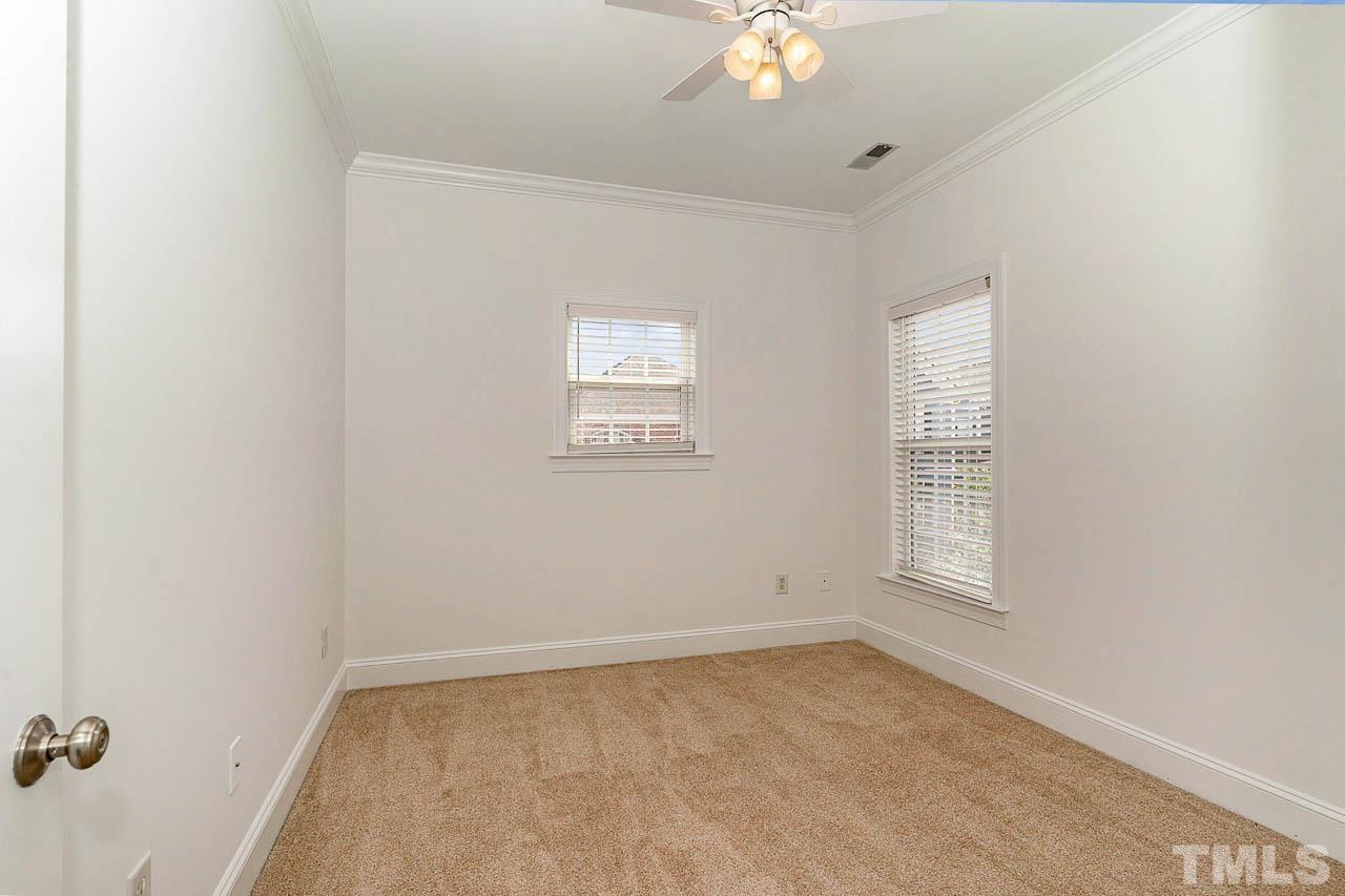 1217 Harp Street Raleigh, NC 27604 - Photo 19 of 27 an empty room with windows and fan