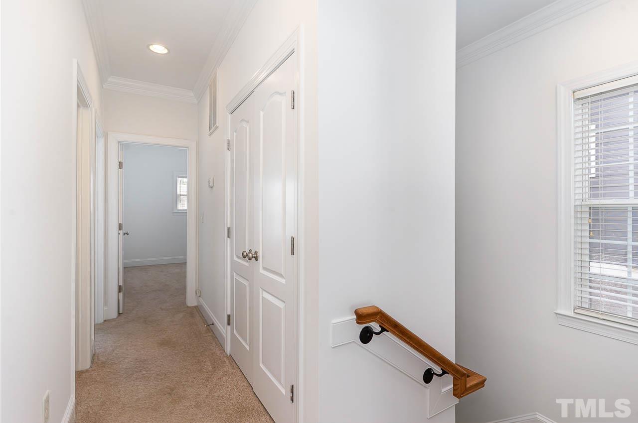 1217 Harp Street Raleigh, NC 27604 - Photo 21 of 27 a view of a hallway with windows