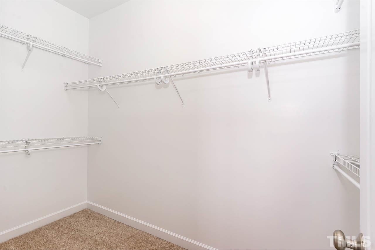 1217 Harp Street Raleigh, NC 27604 - Photo 22 of 27 a view of a room with racks on the wall