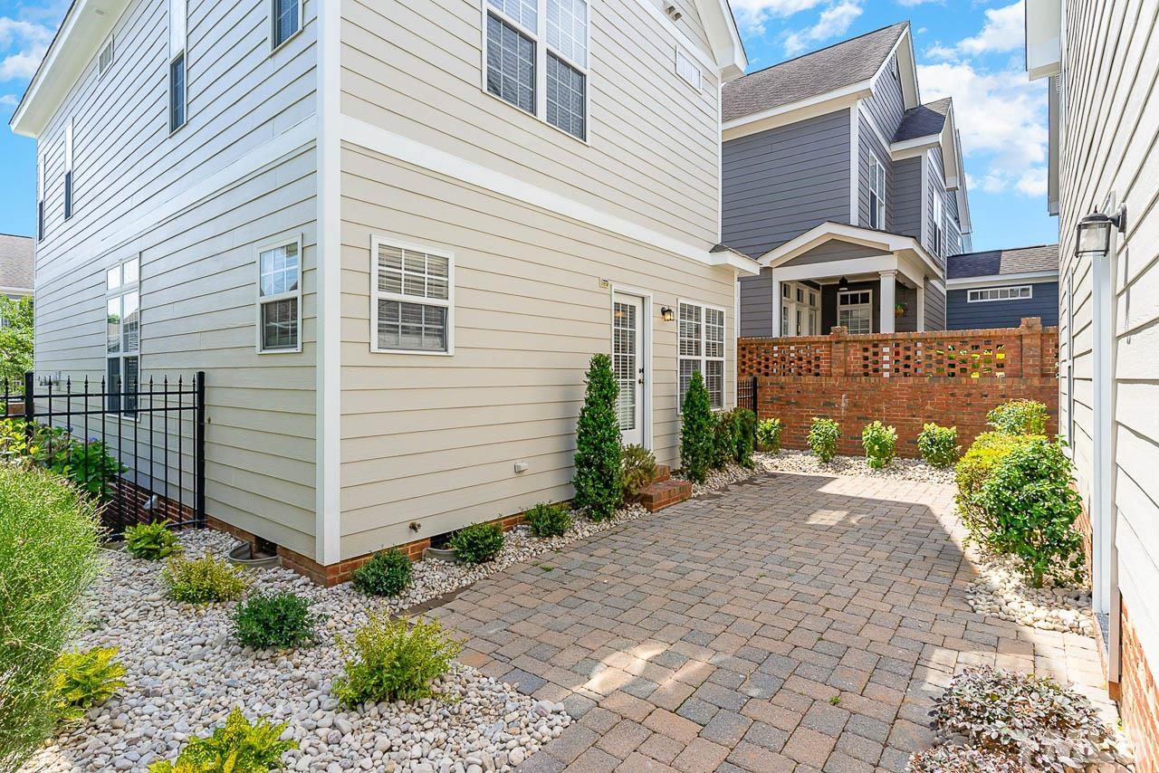 1217 Harp Street Raleigh, NC 27604 - Photo 23 of 27 a front view of a house with garden