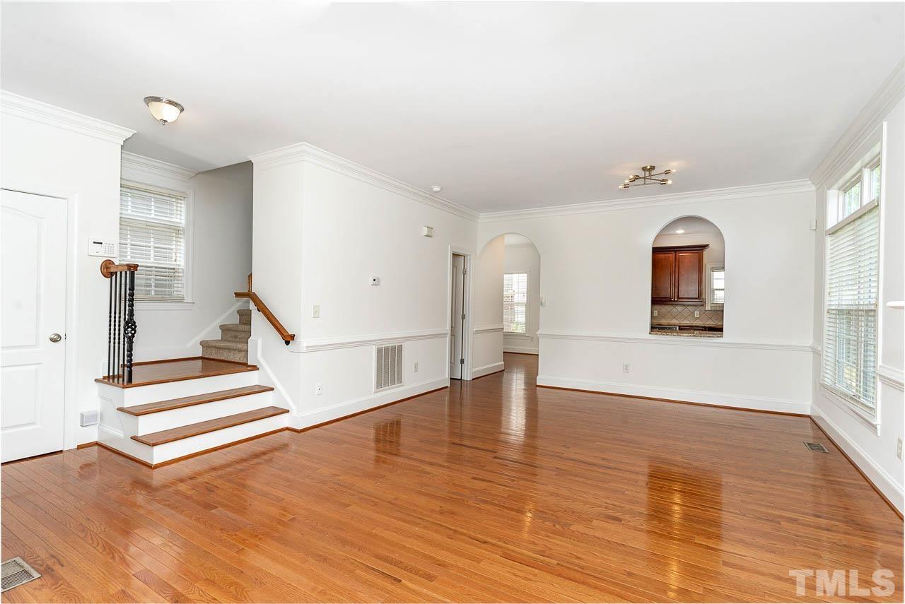 1217 Harp Street Raleigh, NC 27604 - Photo 5 of 27 a view of a room with wooden floor and windows