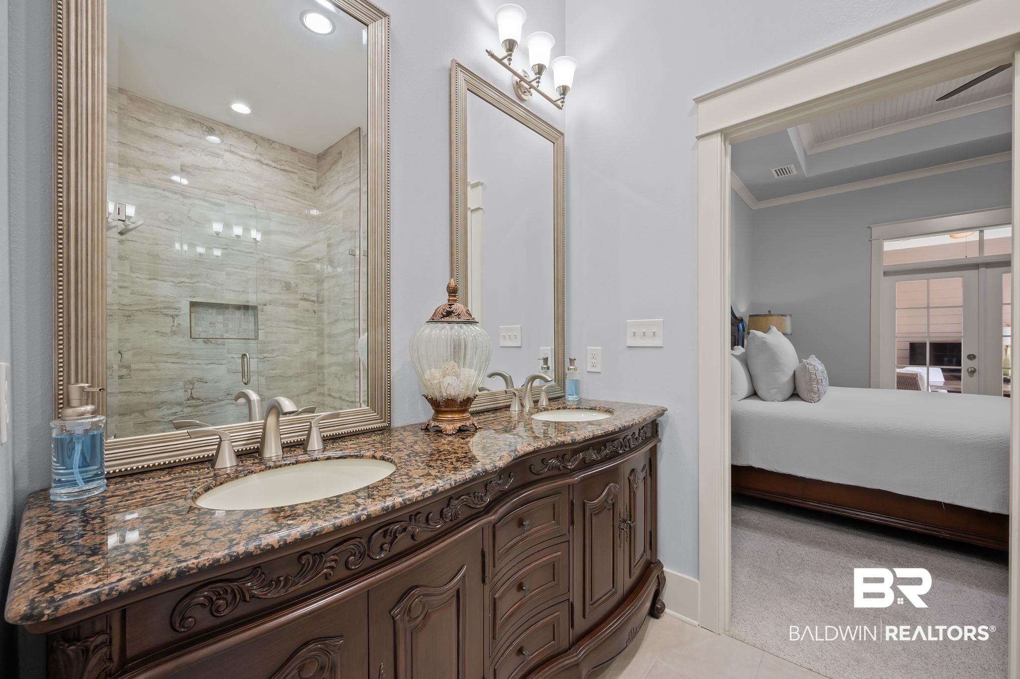 905 Buttercup Lane Foley, AL 36535 - Photo 28 of 47 Full bathroom featuring ensuite bathroom, double vanity, crown molding, tile patterned flooring, and recessed lighting