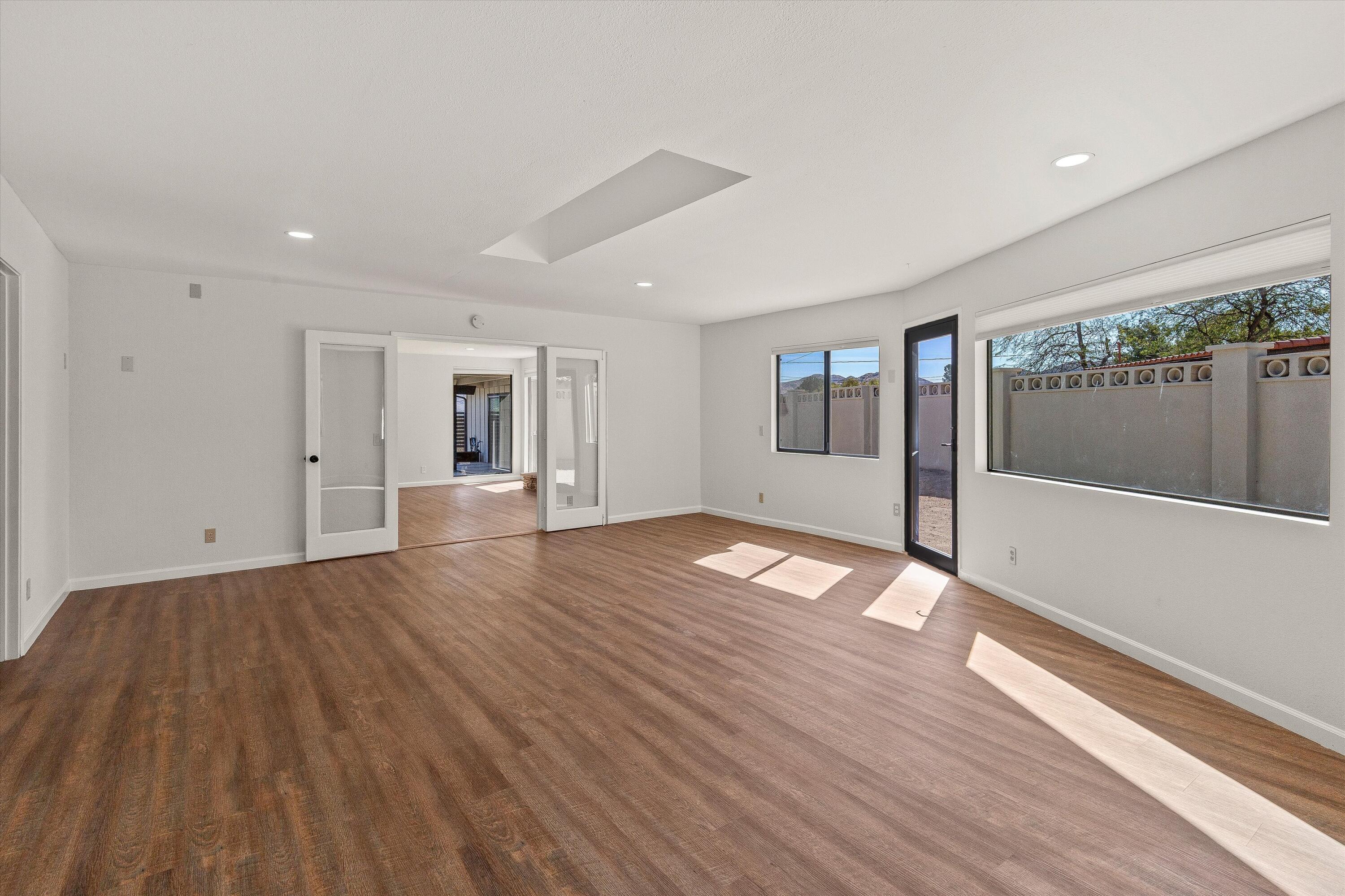 7458 Cardillo Trail Yucca Valley, CA 92284 - Photo 18 of 47 a view of empty room with wooden floor
