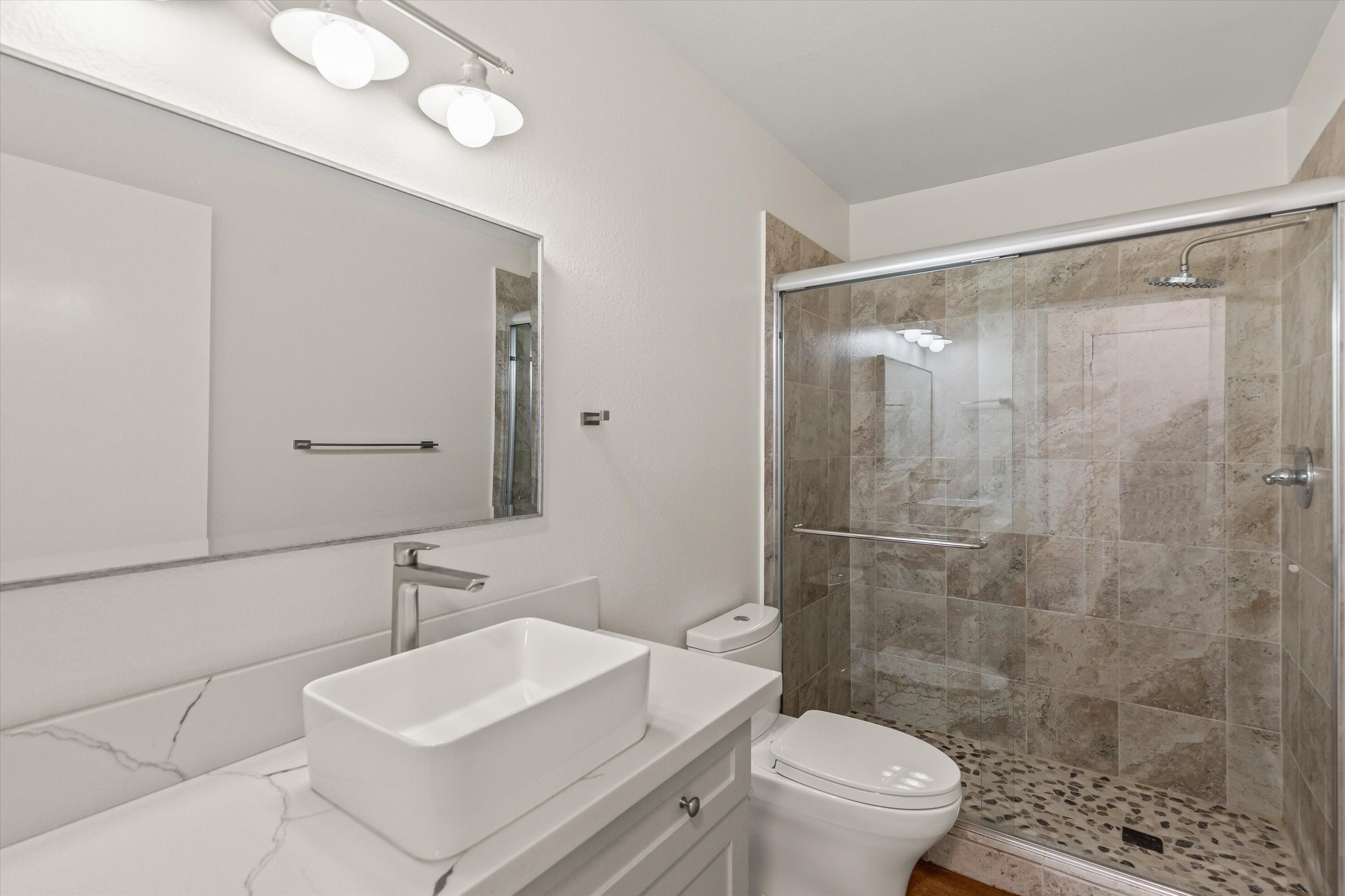 7458 Cardillo Trail Yucca Valley, CA 92284 - Photo 26 of 47 a bathroom with a sink toilet and shower
