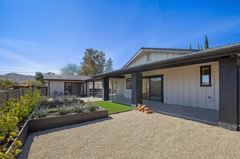 a front view of a house with garden