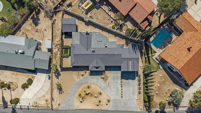 an aerial view of a house with a yard