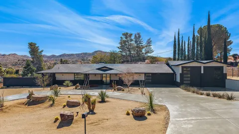 a swimming pool with outdoor seating
