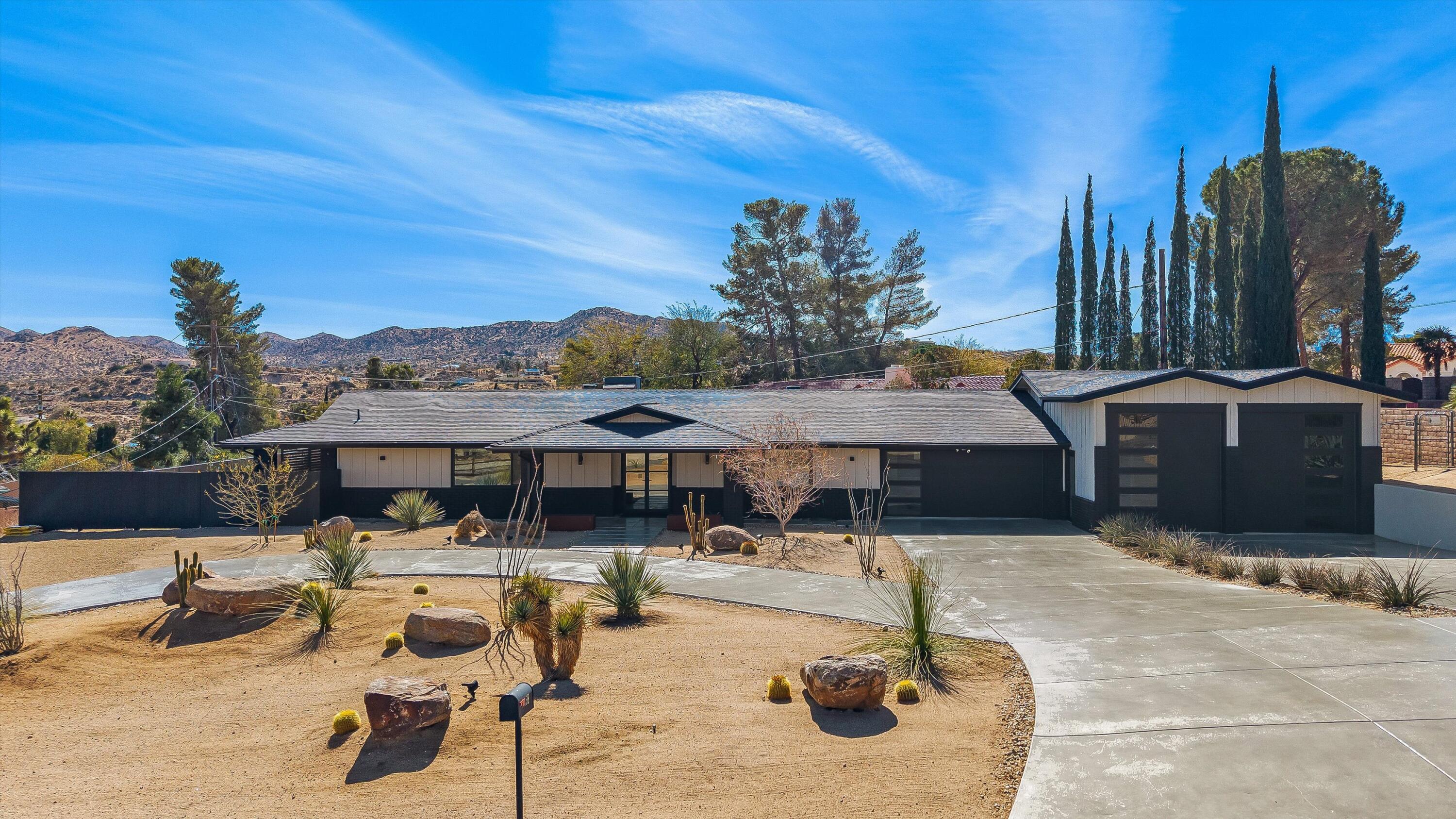 7458 Cardillo Trail Yucca Valley, CA 92284 - Photo 43 of 47 a swimming pool with outdoor seating