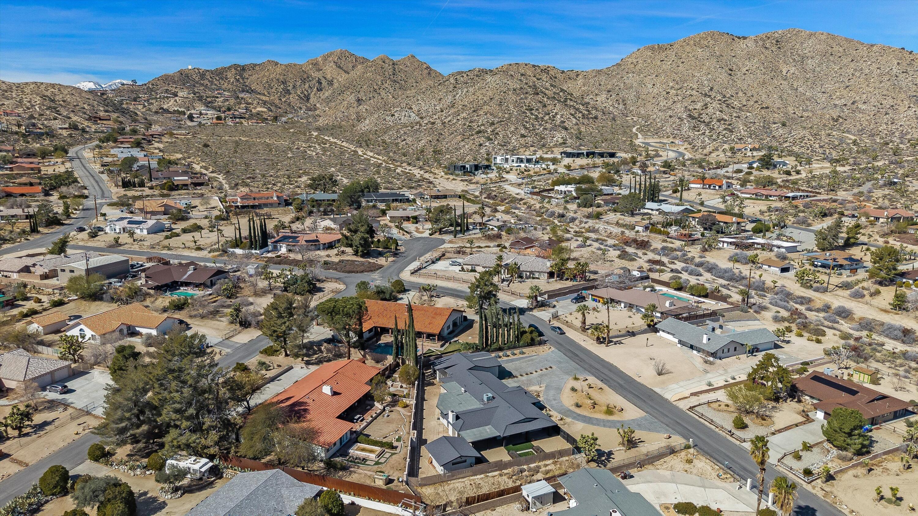 7458 Cardillo Trail Yucca Valley, CA 92284 - Photo 47 of 47 an aerial view of residential houses with outdoor space