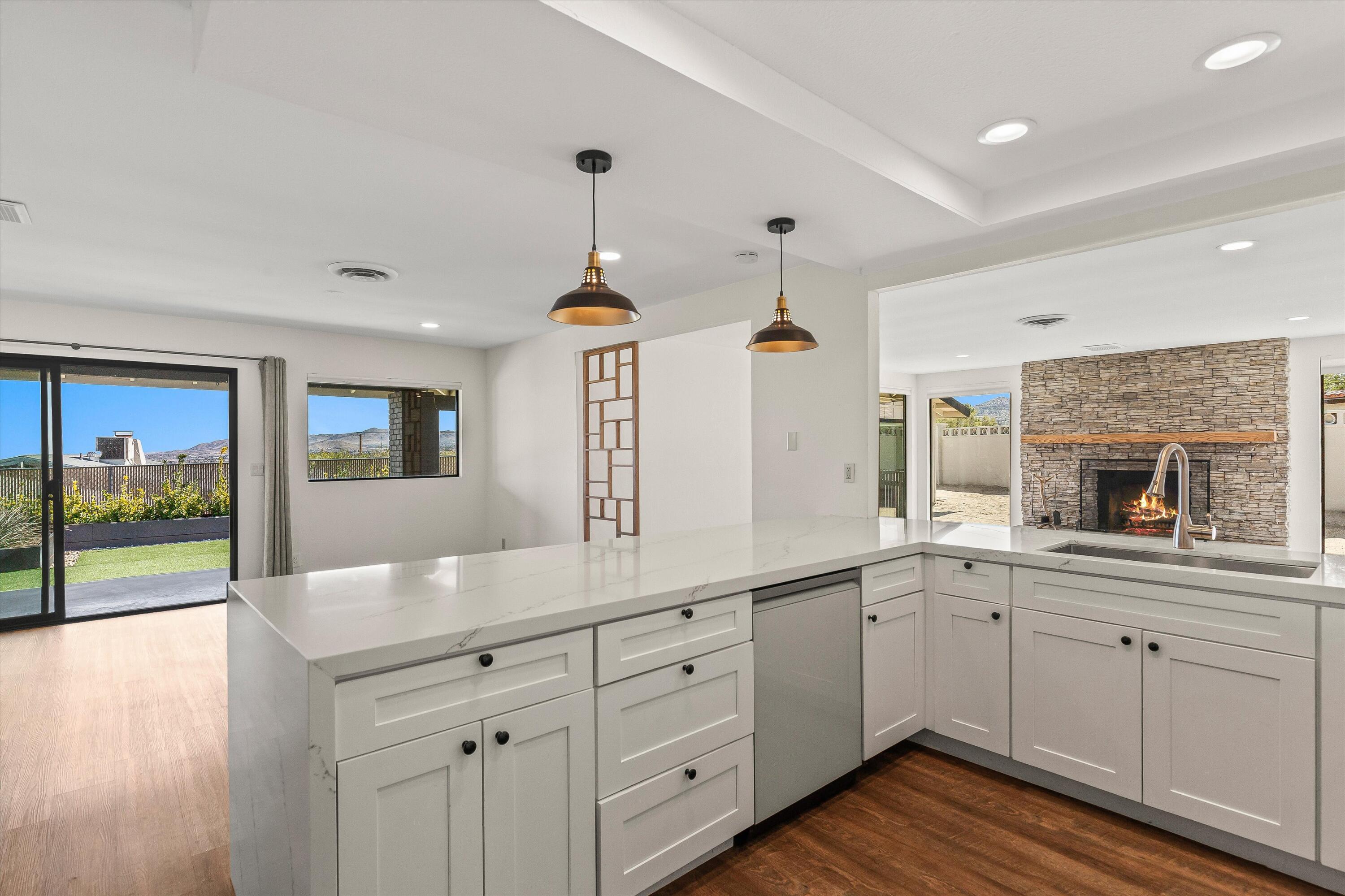 7458 Cardillo Trail Yucca Valley, CA 92284 - Photo 7 of 47 a open kitchen with a sink and dish washer