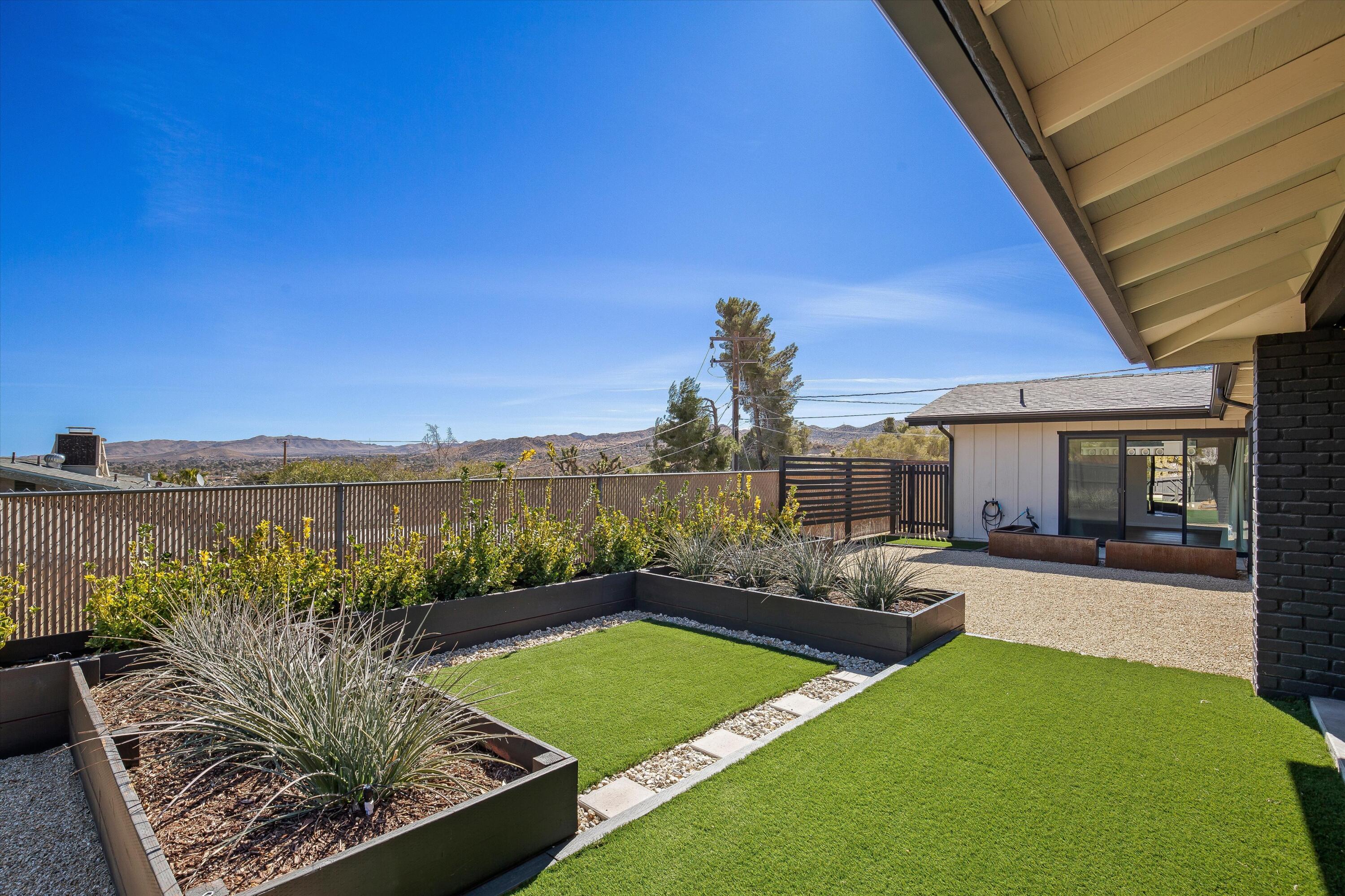 7458 Cardillo Trail Yucca Valley, CA 92284 - Photo 10 of 47 a view of a patio with couches chairs and a table