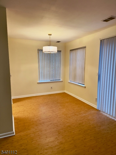 71 Sage Court, Unit 71 Bedminster, NJ 07921 - Photo 3 of 10 a view of an empty room with a window