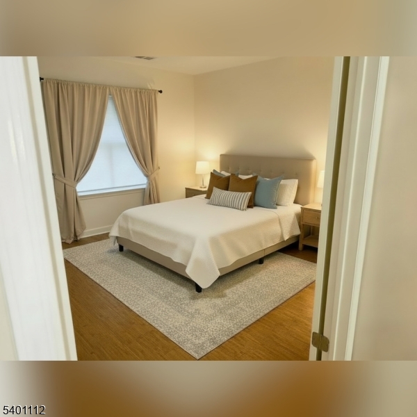 71 Sage Court, Unit 71 Bedminster, NJ 07921 - Photo 6 of 10 a bedroom with a bed and a window