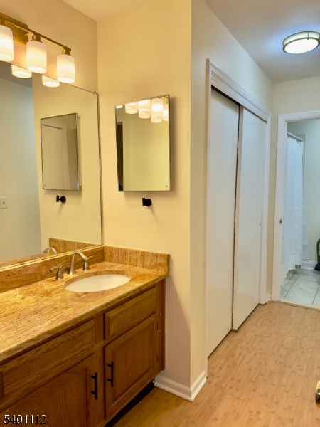 71 Sage Court, Unit 71 Bedminster, NJ 07921 - Photo 7 of 10 a bathroom with a sink and a mirror