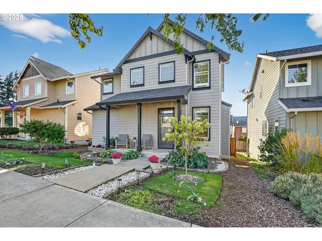 a front view of a house with garden