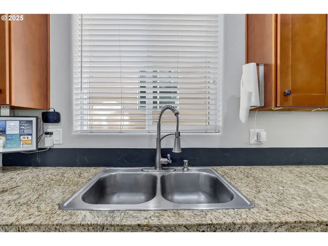 a kitchen with sink and window