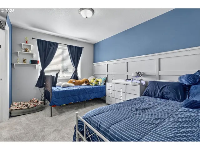 a bedroom with a bed and window