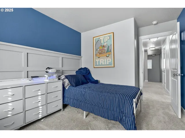 a bedroom with a bed and cabinet