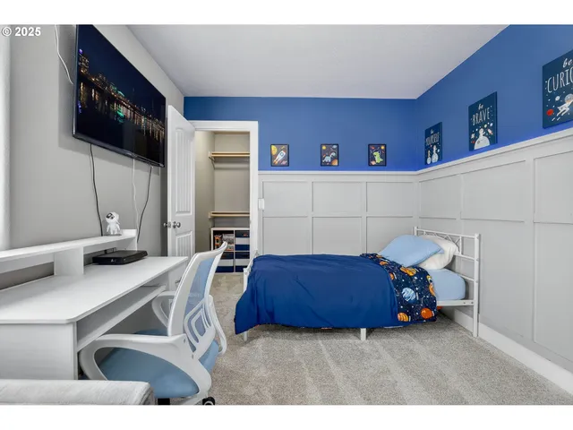 a bedroom with a bed and furniture