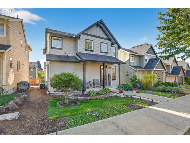 a front view of a house with garden