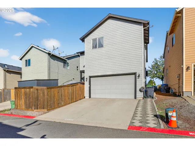 a view of balcony with two chairs and a umbrella